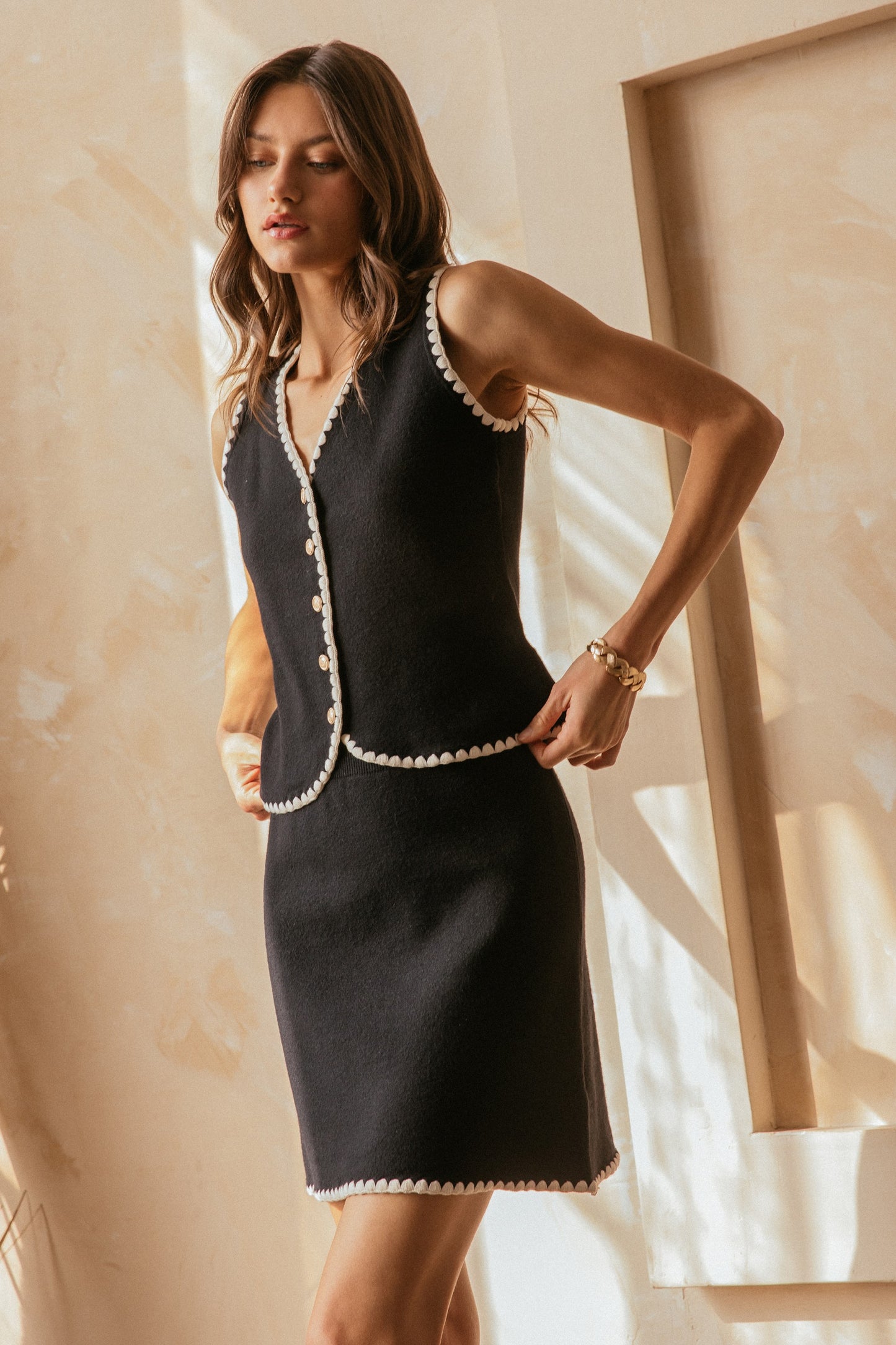 sweater vest with scallop detail