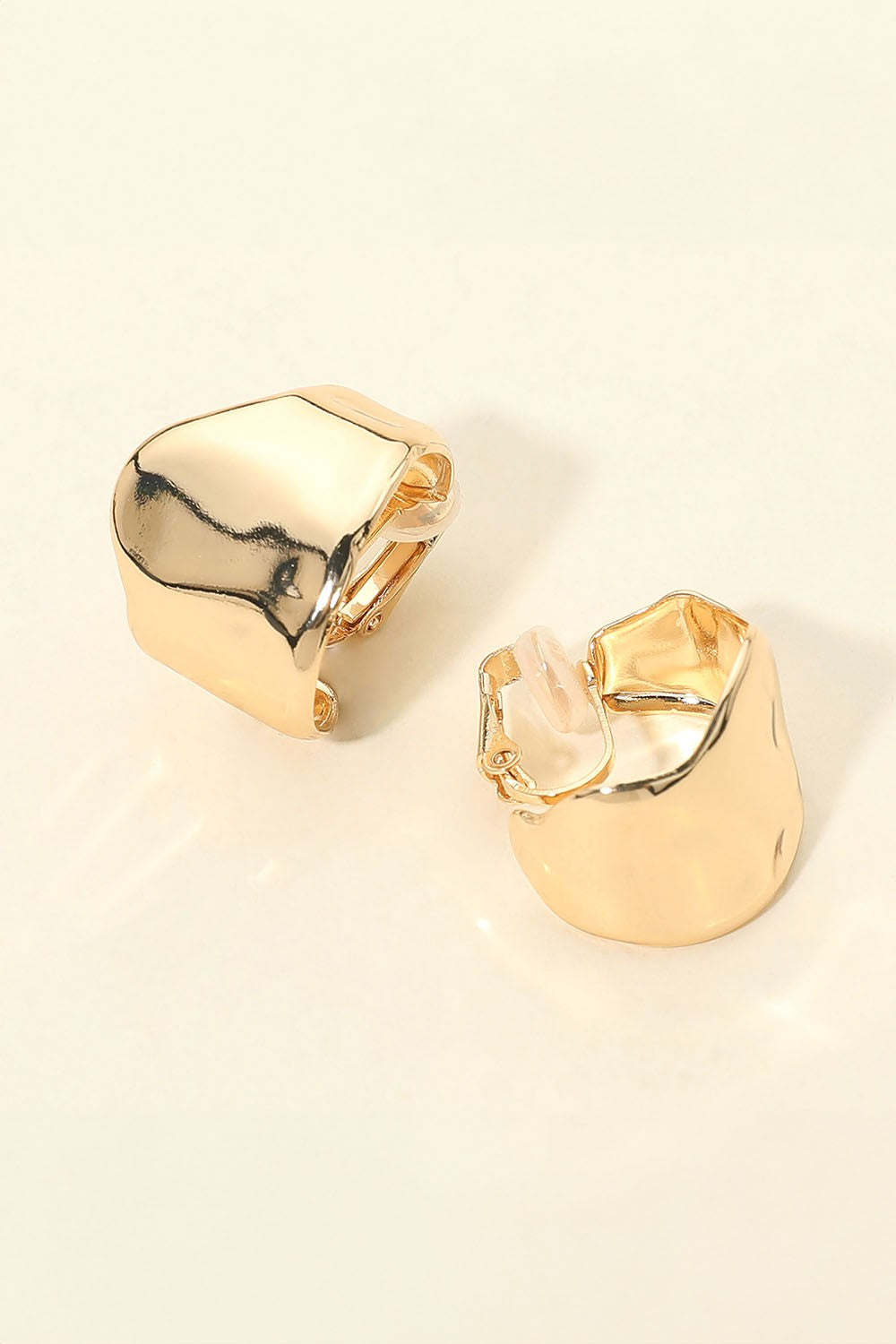 sculpted metal clip on earrings
